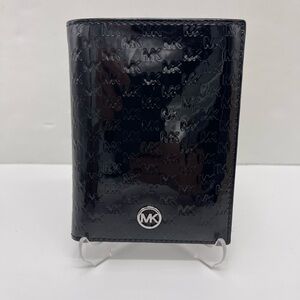 Michael Kors Jet Set Travel Md Signatu Patent Logo Debossed  Passport Case
Black